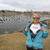 Older woman at a duck pond wearing a Be Good to People Tshirt