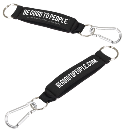 Black Neoprene Key Ring or Holder with Carabiner Clip on one end and key ring. Stap parts and hand can slip through so it can be worn on wrist.